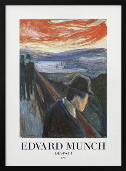 A framed art print of Edvard Munch's 1892 painting, 'Despair'. The expressionist artwork depicts a man in a dark coat and hat leaning over a bridge railing in profile, with a fiery red and orange sunset in the background. Below the image, text reads 'EDVARD MUNCH DESPAIR 1892'. Print