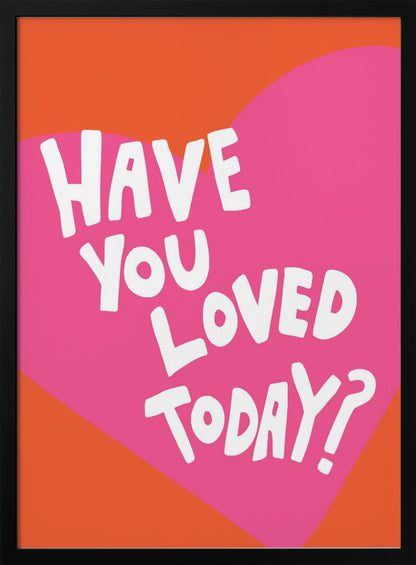 A framed art print with the text 'Have you loved today?' in a playful white font. The text is centered on a large pink heart which is set against a vibrant orange background. Artwork