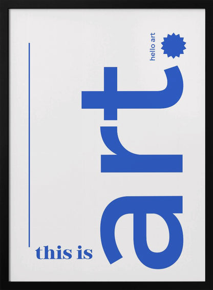 A minimalist art print in a black frame, featuring a white background with blue text. The word 'art' is written vertically in a large, bold lowercase font. To the left, smaller text reads 'this is'. At the top right, 'hello art' is written next to a blue starburst graphic. Wall Art