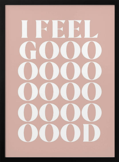 A framed typographic poster featuring the words 'I FEEL GOOOOOD' in a large, white serif font against a dusty pink background. The word 'GOOD' is stylized and stretched vertically with multiple rows of the letter 'O'. Artwork
