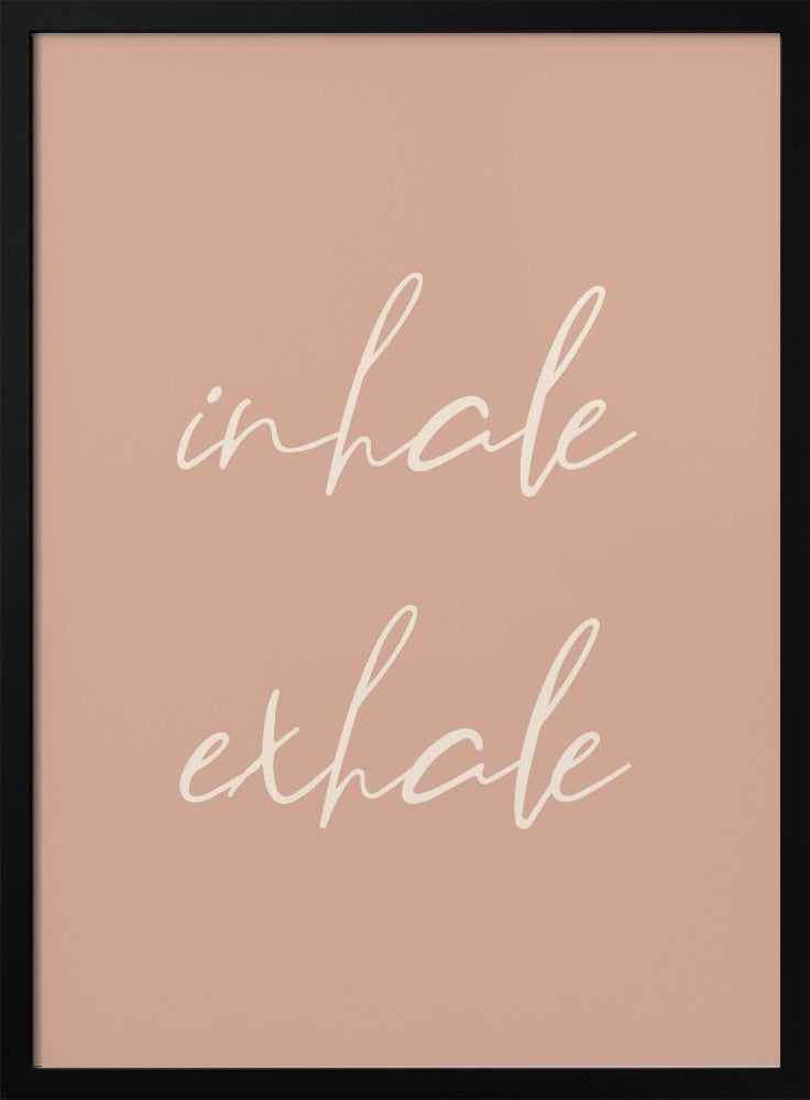 A minimalist framed poster featuring the words 'inhale' and 'exhale' in a flowing white script font, stacked vertically against a solid dusty pink background. Poster