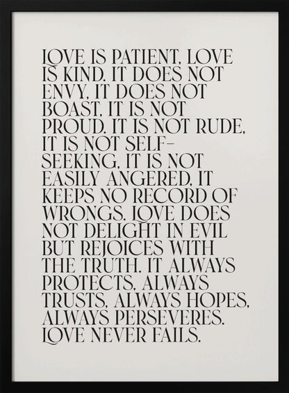 A minimalist art print featuring the 'Love is patient, love is kind...' bible verse from 1 Corinthians 13. The text is printed in a black, all-caps serif font on an off-white background and is surrounded by a simple black frame. Print