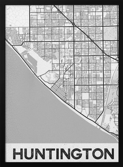 A minimalist black and white framed map of Huntington. The map details the city's street grid next to the coastline, with the name 'HUNTINGTON' printed in bold block letters at the bottom. Print