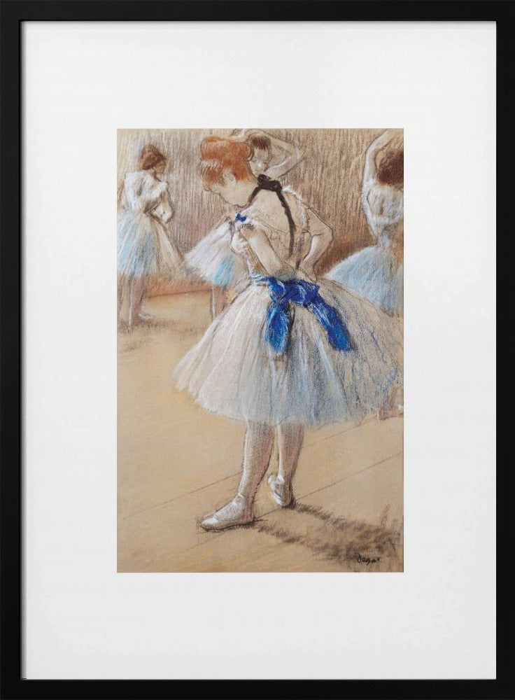 A framed print of an impressionist pastel drawing by Edgar Degas. It shows a ballerina in a white and light blue tutu with a prominent royal blue sash. She is viewed from the side as she adjusts her costume, with other dancers blurred in the background of a dance studio. Poster