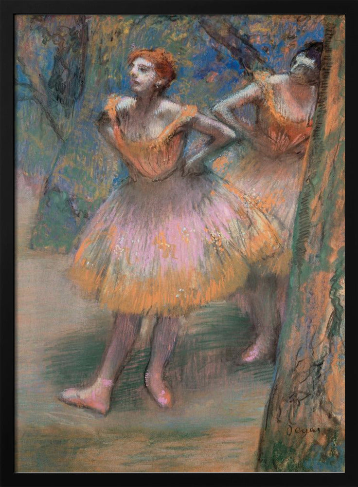 An impressionist pastel painting by Edgar Degas titled 'Dancers in Pink and Orange.' It depicts two ballerinas backstage. The dancer in the foreground has red hair, wears a pink and orange tutu, and stands with her hands on her hips, looking off to the side. A second dancer is partially visible behind her. The background is a textured blend of blues, greens, and browns. Artwork