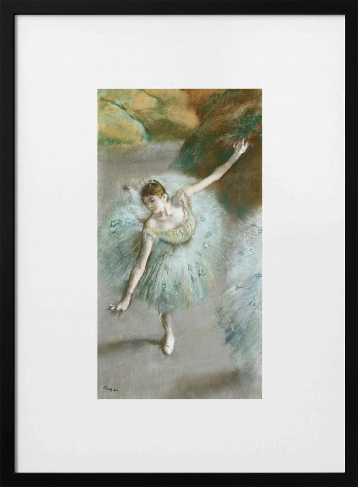 A framed vertical reproduction of an Edgar Degas painting showing a ballerina from a high angle. She wears a voluminous light blue tutu and is posed gracefully with arms outstretched against a soft, impressionistic background of earthy browns and tans. Poster