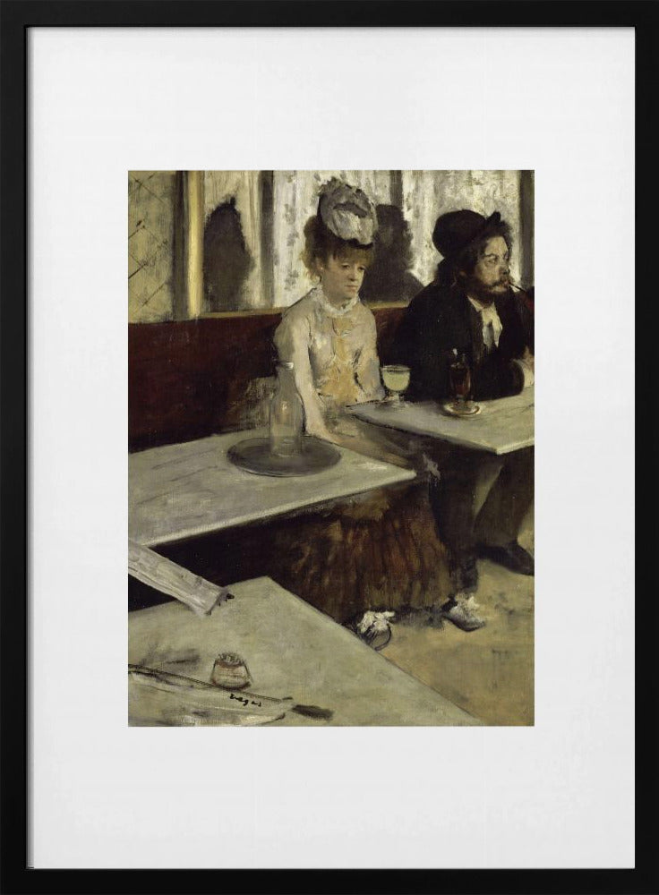 A framed print of Edgar Degas's painting 'L'Absinthe,' depicting a somber-looking man and woman sitting at adjacent tables in a 19th-century Parisian cafe, conveying a sense of alienation and melancholy. Print