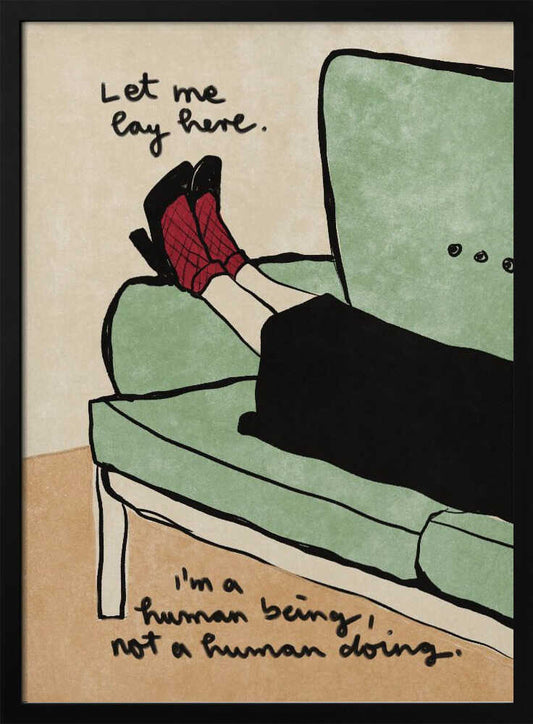 An illustration of a person's lower legs and feet propped up on a sage green armchair. The person wears red patterned socks and black high heels. Handwritten text above the feet reads, 'Let me lay here.' and text at the bottom reads, 'I'm a human being, not a human doing.' The background is a neutral beige, and the artwork has a simple, hand-drawn style with black outlines. Decor