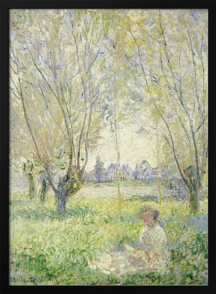 An Impressionist painting, 'Springtime' by Claude Monet, showing a woman in a hat sitting in a sunlit green field. Slender trees with light green foliage frame a view of a village across a river, evoking a peaceful spring day. The artwork is presented in a simple black frame. Artwork