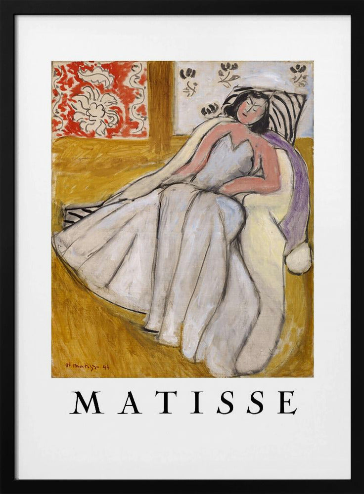 An art print poster of a Henri Matisse painting. The image features a woman with dark hair wearing a long, light-colored dress, reclining in a golden-yellow armchair. The background includes a red and white floral pattern and other decorative elements. The word 'MATISSE' is printed in large black letters below the artwork, all enclosed in a black frame. Decor