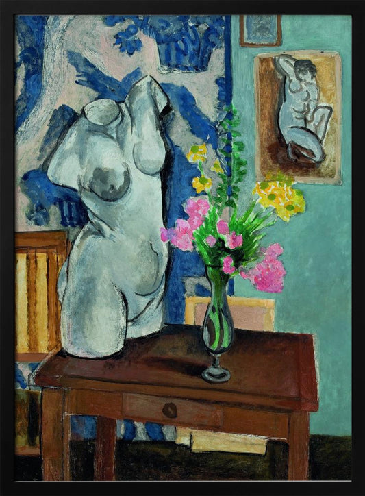 A colorful still life painting by Henri Matisse depicting a white plaster torso of a woman on a dark brown table next to a vase of bright pink and yellow flowers. The background features a blue and white patterned fabric and a light blue wall with a small framed nude drawing. Decor