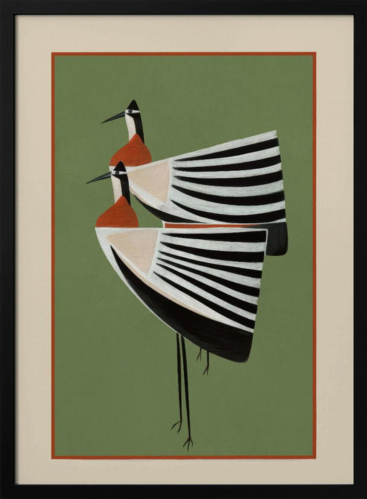 A framed art print featuring two highly stylized birds standing against a solid sage green background. The birds have boat-shaped bodies with bold black and white stripes, orange chests, and long thin black legs and beaks. Wall Art