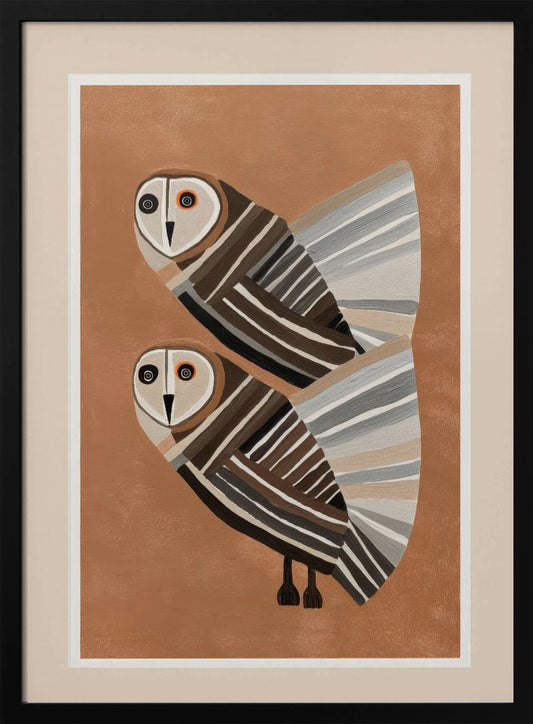 A framed modern art print of two stylized barn owls against a warm brown background. The owls are decorated with geometric stripes in shades of brown, beige, grey, and black, and have large, captivating eyes. Wall Art