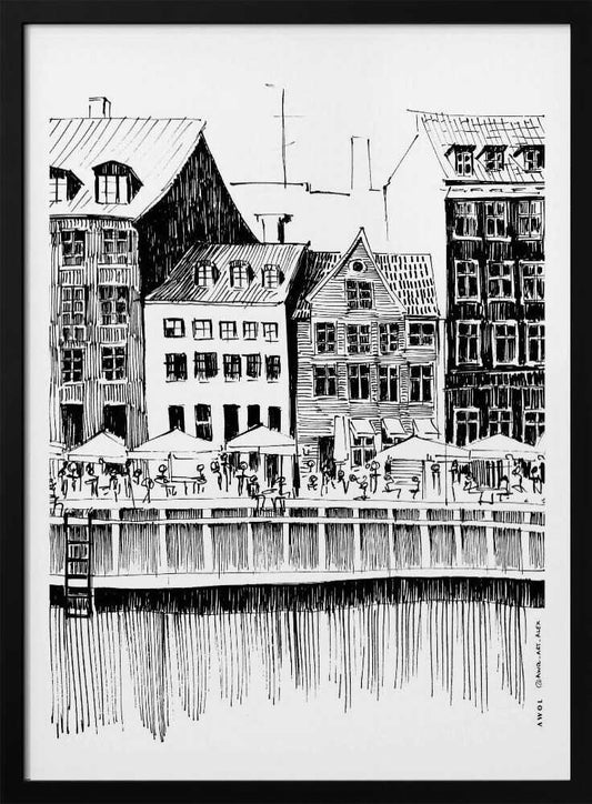 A black and white ink line drawing of a charming European city scene along a canal. Tall, narrow buildings with gabled roofs line the waterfront, in front of which is a bustling pier with outdoor cafes filled with people under umbrellas. The water's reflection is illustrated with simple vertical lines. The artwork is framed in black. Wall Art