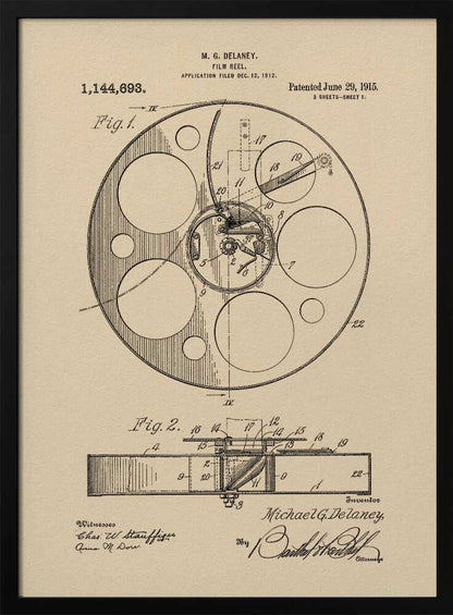 A framed vintage patent illustration of a film reel from 1915 by M.G. Delaney. The drawing is in black ink on a beige background, showing detailed schematics of the reel's mechanics from two different angles, complete with numbered parts, signatures, and patent information. Wall Art