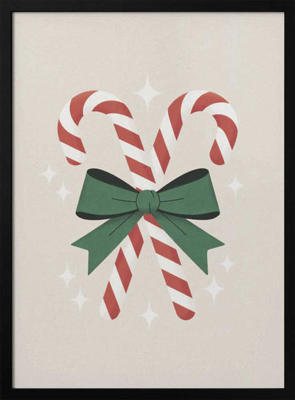 An illustration of two red-and-white striped candy canes crossed and tied together with a large green bow. The background is a soft beige color with small, white, four-pointed star sparkles. The artwork is shown in a black frame. Decor
