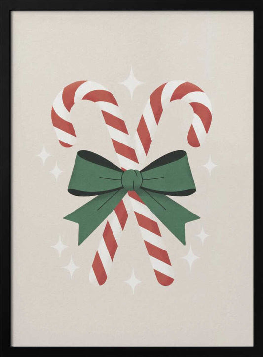 An illustration of two red-and-white striped candy canes crossed and tied together with a large green bow. The background is a soft beige color with small, white, four-pointed star sparkles. The artwork is shown in a black frame. Decor