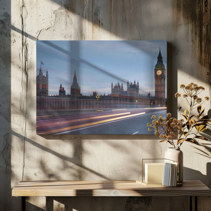 A framed, long-exposure photograph of London's Big Ben and the Houses of Parliament at dusk. In the foreground, streaks of red and yellow light from moving traffic blur across a bridge, creating a dynamic contrast with the historic architecture against a twilight sky. Decor