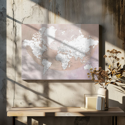 A modern world map in a silver frame, featuring white continents and dusty pink oceans. The map is detailed with black typography for countries, cities, and oceans. Print