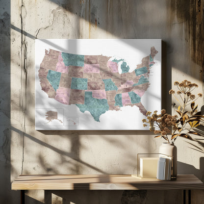 A stylized map of the United States in a silver frame. The states are colored with a marbled texture in alternating shades of muted brown, dusty pink, and teal. Each state is labeled, and the words 'UNITED STATES' are spaced across the country. Insets for Alaska and Hawaii are in the bottom left corner. Artwork