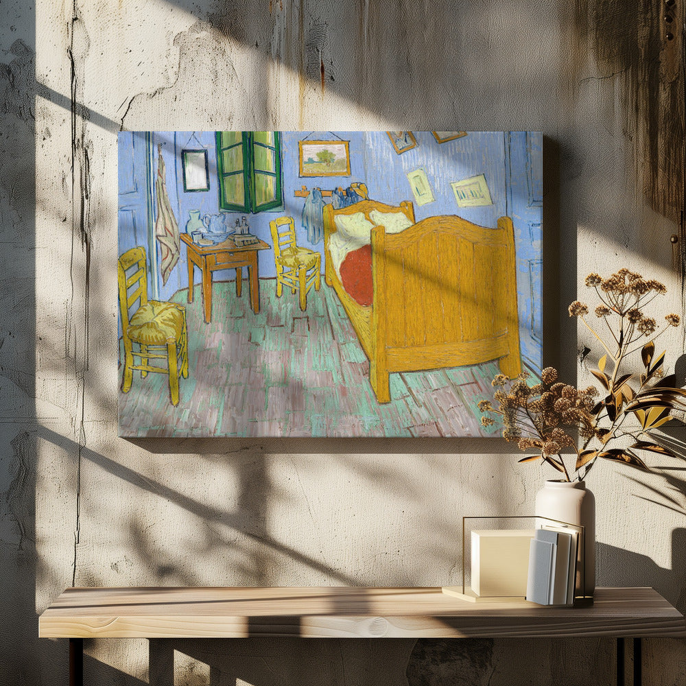 Vincent van Gogh's famous painting, 'The Bedroom,' depicting his room in Arles. The artwork, characterized by bold colors and expressive brushstrokes, features a yellow wooden bed, chairs, a small table against light blue walls, and a green-shuttered window. The painting is displayed in a simple silver frame. Decor