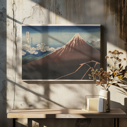 A classic Japanese ukiyo-e woodblock print by Hokusai, 'Thunderstorm Beneath the Summit', depicting a reddish-brown Mount Fuji with its snowy peak against a blue sky. Stylized clouds gather below the summit, and a fork of lightning illuminates the dark landscape at the mountain's base. Print