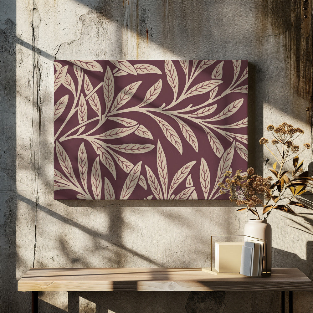 A framed piece of art with a repeating pattern of stylized, cream-colored leaves and branches on a deep burgundy background. The frame is a simple silver. Poster