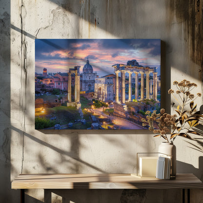 A scenic photograph of the ancient Roman Forum in Rome, Italy, at dusk. The ruins, including prominent columns and arches, are illuminated by warm lights, contrasting with the deep blue and vibrant pink of the sunset sky. Wall Art