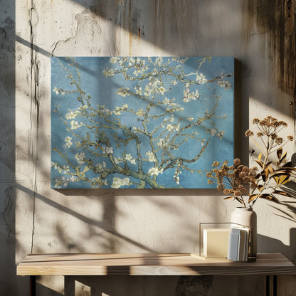 A framed print of Vincent van Gogh's painting 'Almond Blossom,' featuring delicate white blossoms on gnarled branches set against a vibrant turquoise-blue sky. Poster