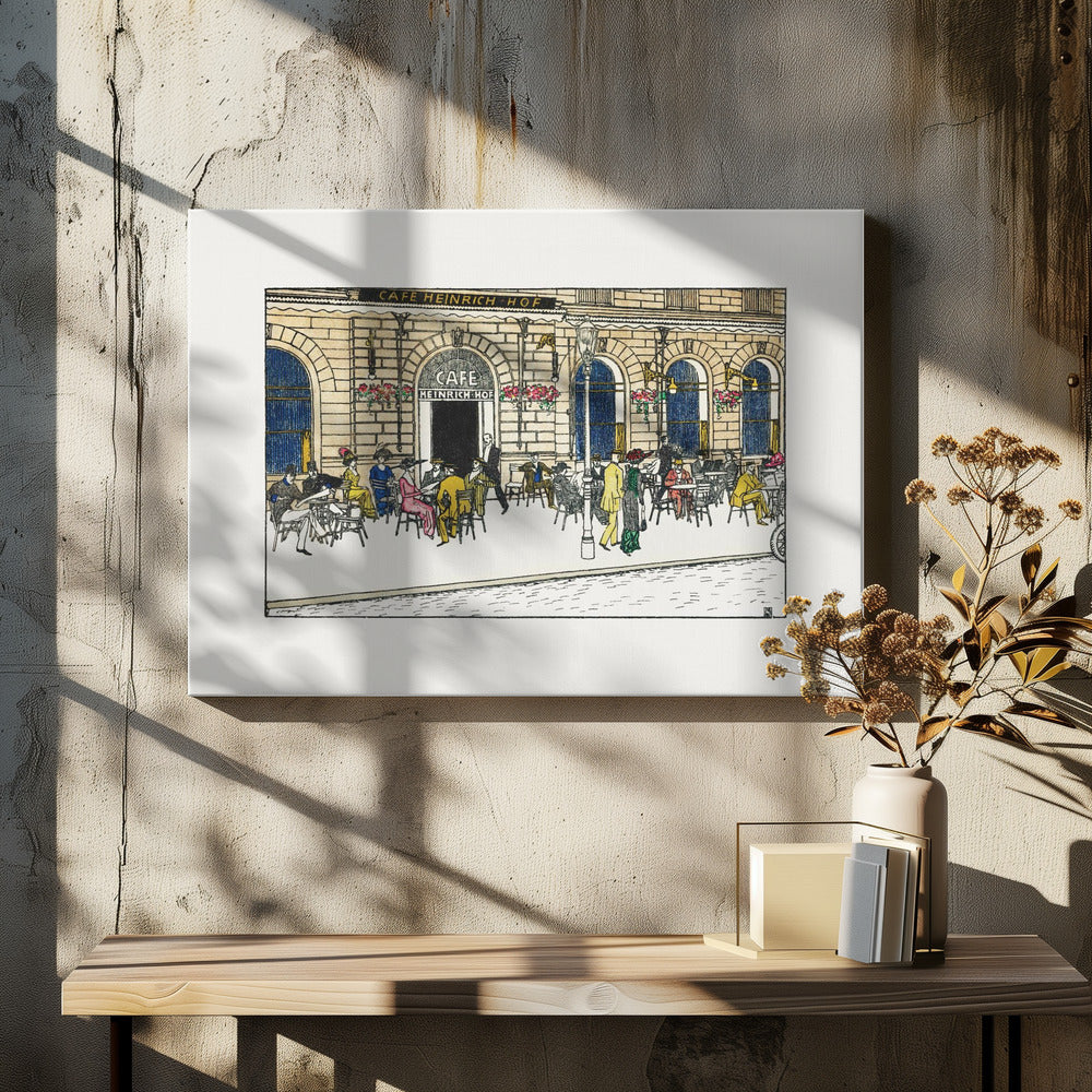 A vintage-style color illustration of the exterior of 'Cafe Heinrich Hof'. Patrons dressed in early 20th-century attire are seated at tables on the sidewalk patio, socializing under the building's arched windows. The artwork is shown within a silver frame. Decor