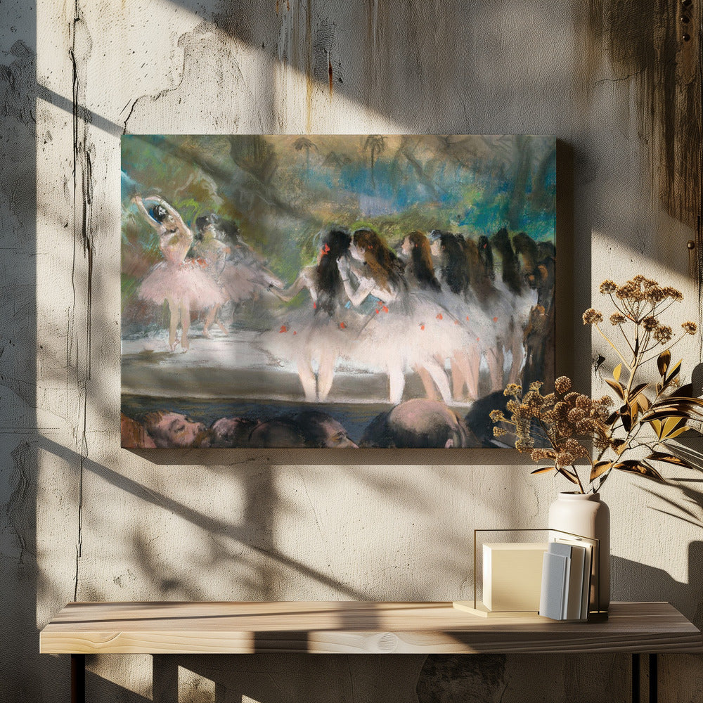 An impressionistic painting by Edgar Degas of a ballet performance, showing ballerinas in pink and white tutus on a stage with a lush backdrop, as seen from the perspective of the audience. The artwork is mounted in a silver frame. Artwork
