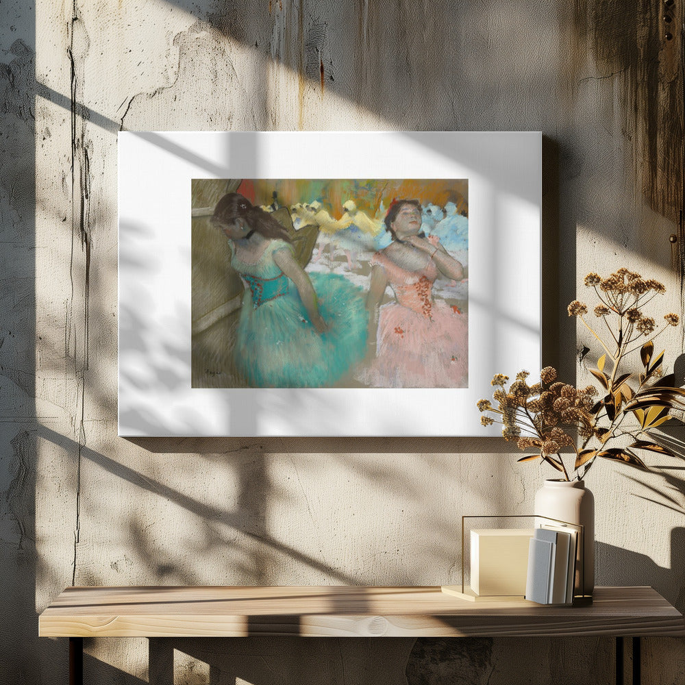 An impressionist pastel painting by Edgar Degas of two ballerinas backstage. One in the foreground wears a teal tutu and looks down, while another beside her in a pink tutu adjusts her choker. Other dancers are visible in the background under warm stage light. Poster