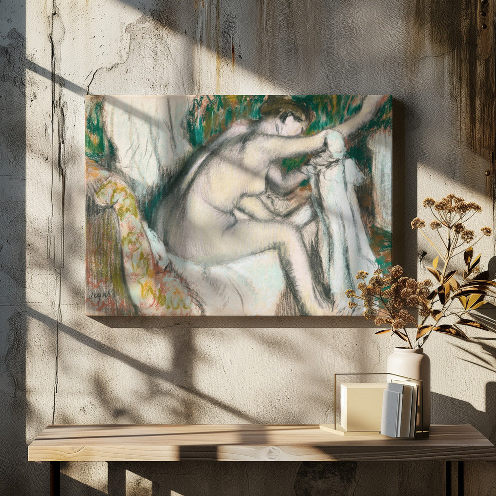 A framed pastel drawing by Edgar Degas depicting a nude woman from the back, seated on a patterned chair. Her body is rendered in soft yellow and grey tones, while she interacts with white drapery against a background of energetic green and brown strokes. Print