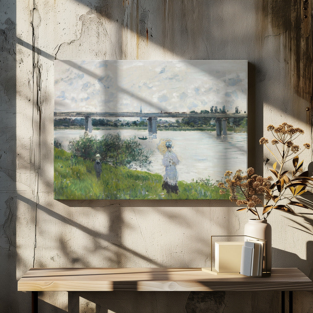 A scenic landscape art print by Claude Monet titled 'The Promenade With the Railroad Bridge, Argenteuil', depicting people on a promenade alongside a body of water with a railroad bridge in the background, characteristic of Impressionist style with soft colors and brushstrokes. Print