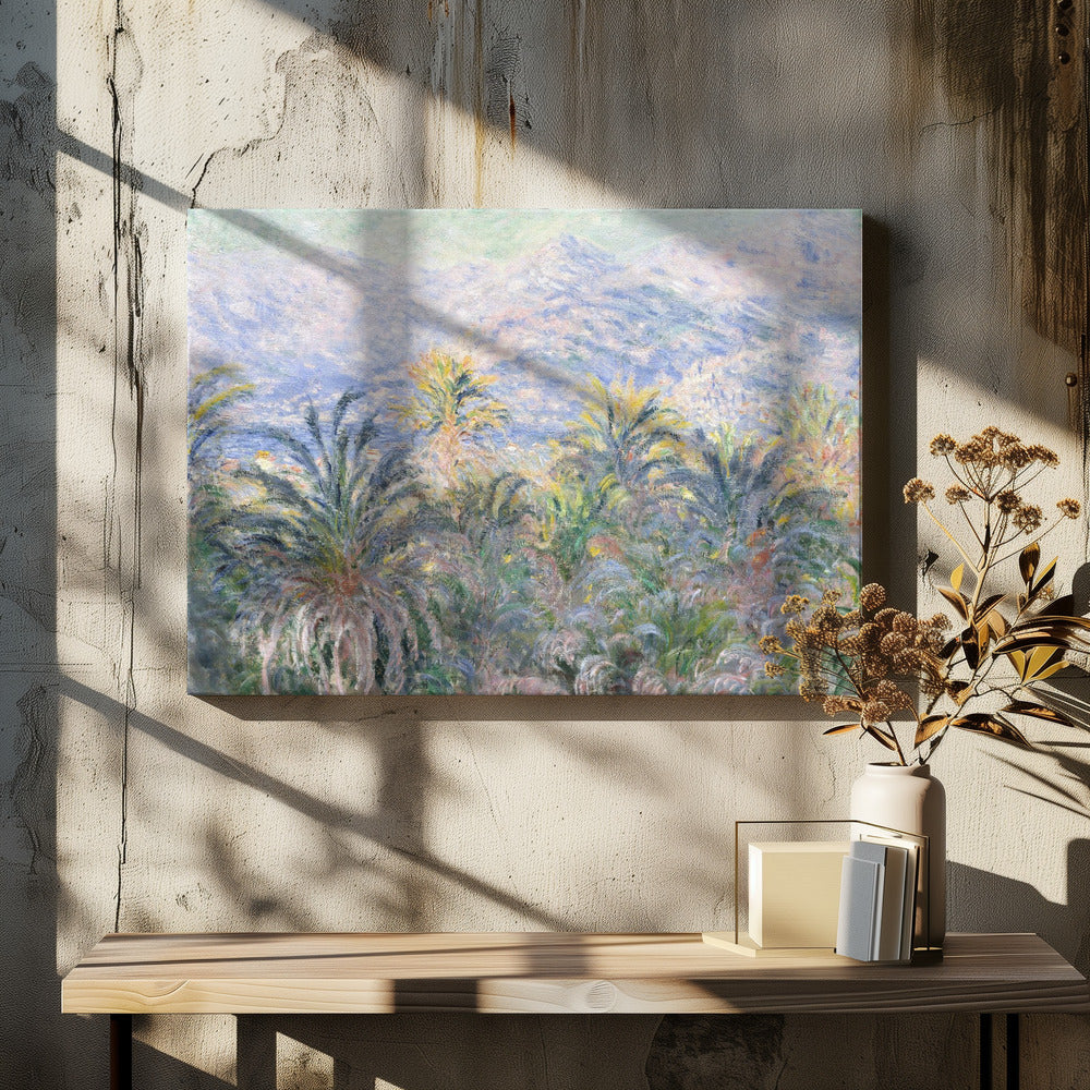 Impressionist painting 'View of Bordighera' by Claude Monet, featuring a lush foreground of green and yellow palm trees overlooking a hazy, sun-drenched coastal town and distant blue mountains, all rendered with soft, dappled brushstrokes and set within a silver frame. Artwork