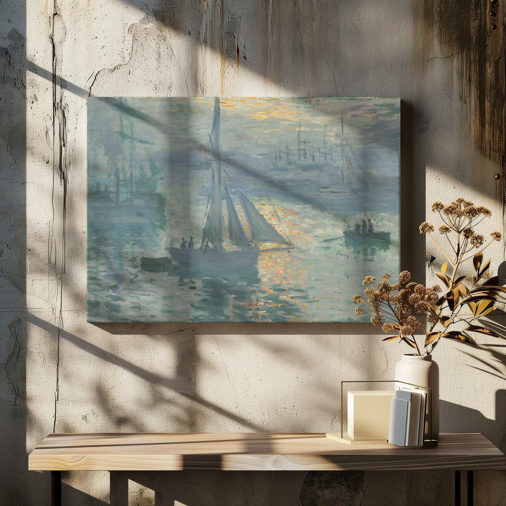 A framed print of Claude Monet's famous Impressionist painting, 'Impression, Sunrise'. The artwork depicts a misty harbor scene in muted blue and grey tones. A bright orange sun is visible through the haze, its light reflecting on the water's surface. Several boats, including a prominent sailboat in the foreground, are silhouetted against the dawn light. Print