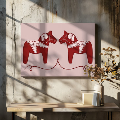 A symmetrical illustration of two red Swedish Dala horses facing each other against a light pink background. The horses are decorated with intricate white and pink folk art patterns. The artwork is presented within a silver frame. Artwork