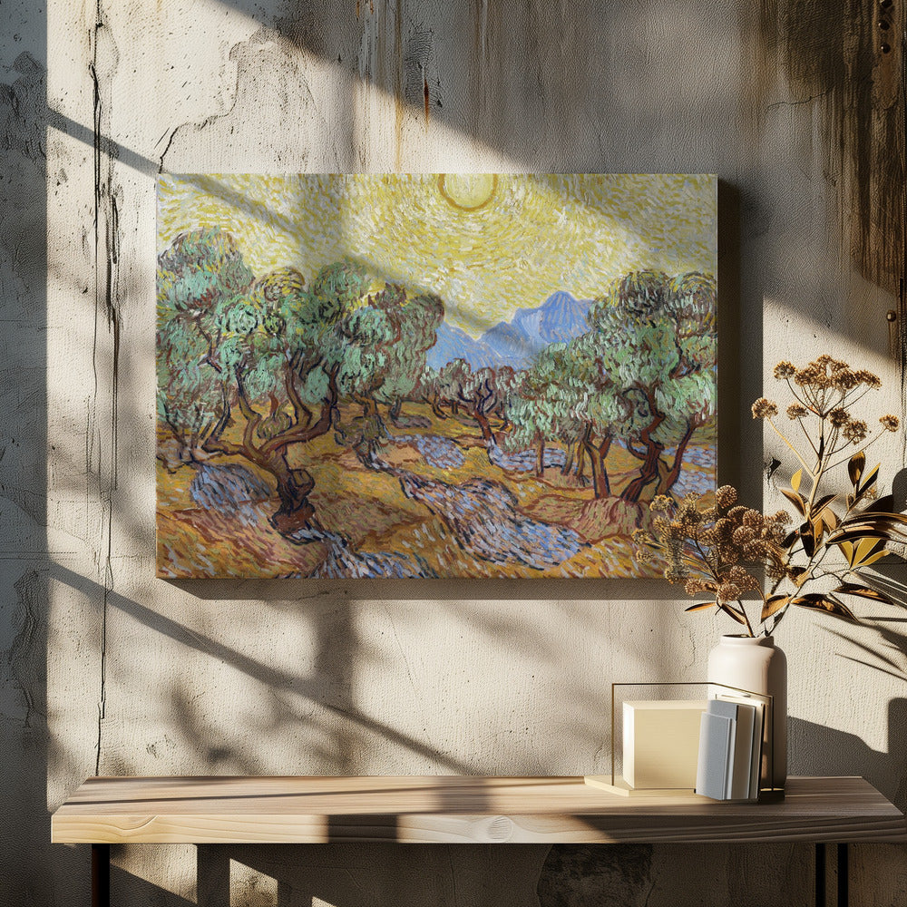 A framed Post-Impressionist painting by Vincent van Gogh depicting an olive grove under a bright yellow sun and sky. The olive trees have gnarled brown trunks and green leaves, set against a rolling landscape of ochre and lavender shadows. In the distance, blue mountains rise against the vibrant sky. The entire scene is painted with thick, energetic brushstrokes. Decor