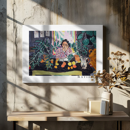 A framed print of the painting 'Woman with a Book' by Henri Matisse. The artwork features a woman in a red, white, and blue striped shirt sitting at a dark table filled with potted green plants and colorful fruit. She rests her head on her hand, looking out from the painting in a Fauvist style with bold colors and expressive brushwork. Poster