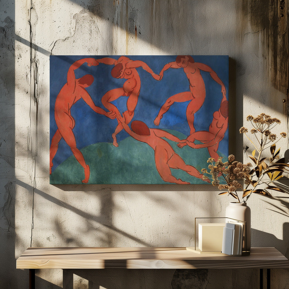 A framed print of Henri Matisse's painting 'The Dance,' featuring five nude, reddish-orange figures holding hands and dancing in a circle against a vibrant blue sky and a green hill. Decor