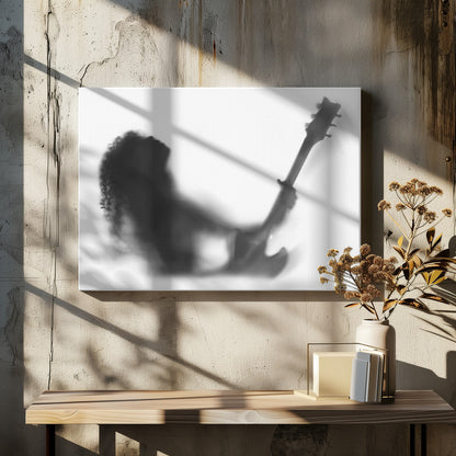 A framed, black and white photograph showing the blurry silhouette of a rock guitarist with long curly hair, head thrown back in passion while holding an electric guitar against a stark white background. Poster