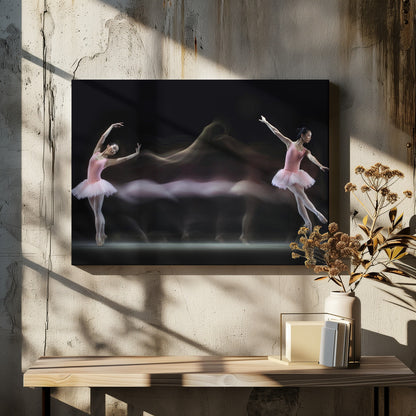 A long-exposure photograph capturing the fluid motion of a ballerina in a pink leotard and tutu. Two clear poses of the dancer frame a central, ethereal blur of movement against a dark, solid background, all encased in a silver frame. Artwork