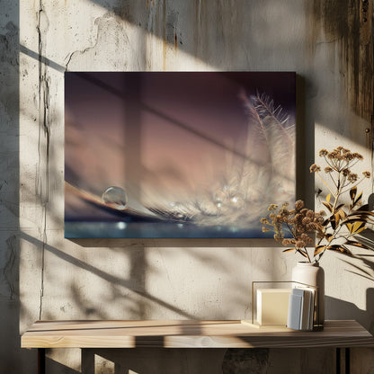 A serene macro photograph of a single, perfect water droplet resting on a delicate white feather. The background is a soft, warm gradient from dark to light brown, creating a peaceful and fragile mood. Artwork