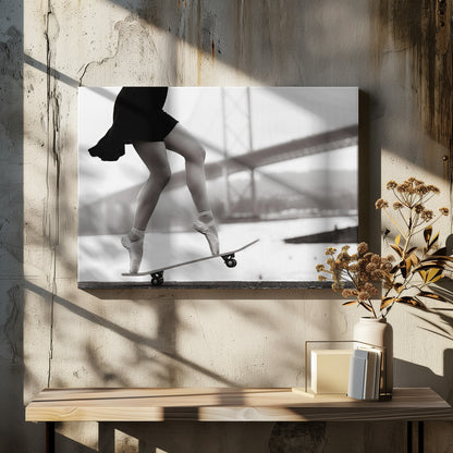 A black and white photograph of a ballerina's legs in a black dress, balancing en pointe on a skateboard with a blurred bridge in the background. Artwork