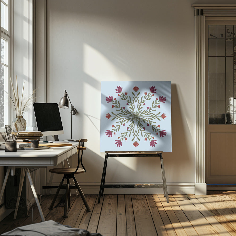 A framed art print with a symmetrical floral mandala on a light blue background. Olive green stems and leaves radiate from the center, blooming with magenta and red flowers. The artwork is enclosed in a light wood frame. Wall Art
