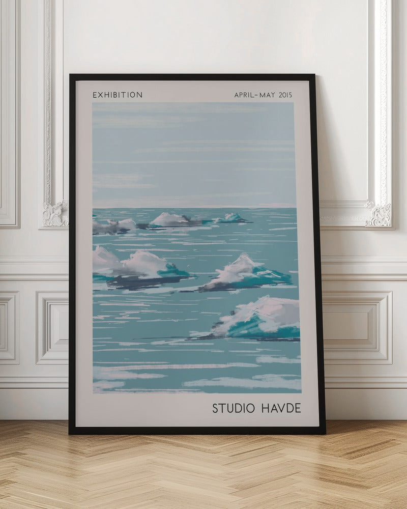 A framed exhibition poster from 'Studio Havde' dated April-May 2015. The artwork is a stylized, painterly seascape featuring white clouds or icebergs floating on a calm, teal-blue ocean under a pale sky. The piece is set within a wide, off-white border and a simple black frame. Wall Art