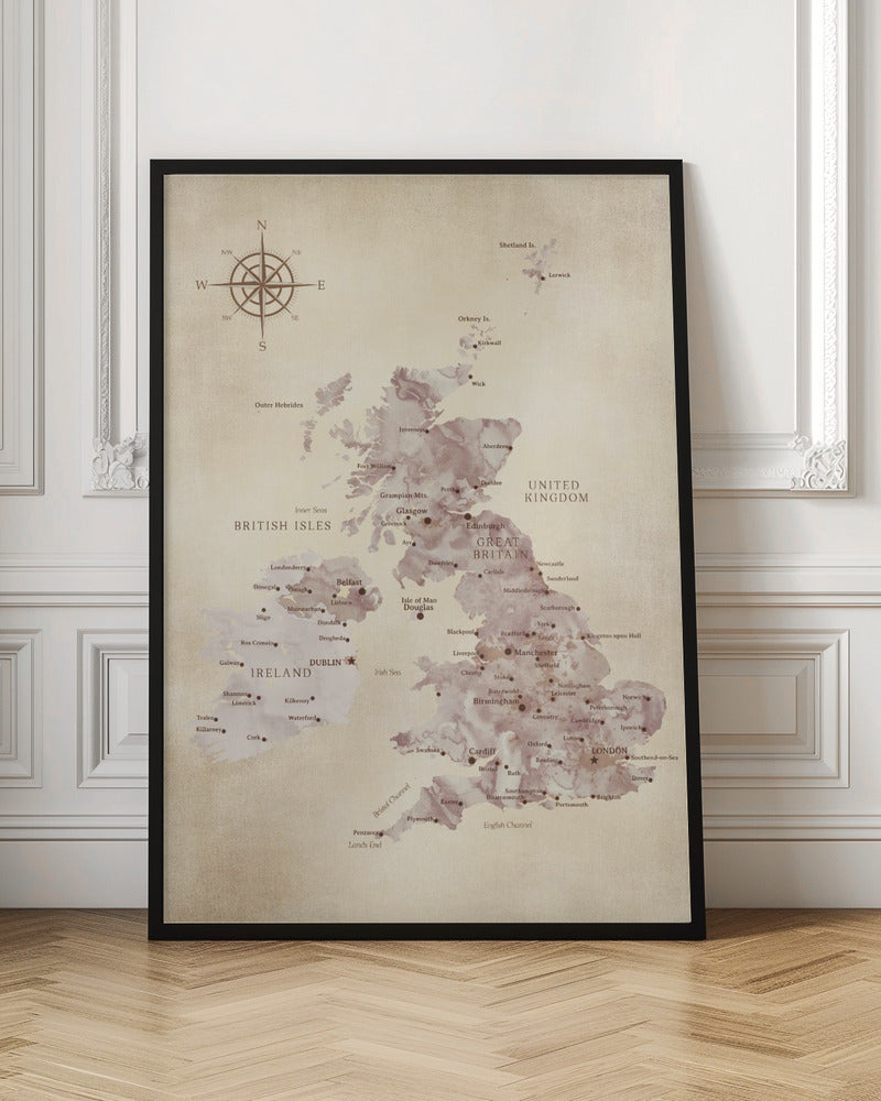 A vintage-style map of the British Isles, including Great Britain and Ireland, presented in a black frame. The map has a textured, parchment-like background, with the landmasses depicted in a muted, purple-brown watercolor effect. Major cities are labeled in a classic font, and a compass rose is featured in the upper left corner. Artwork