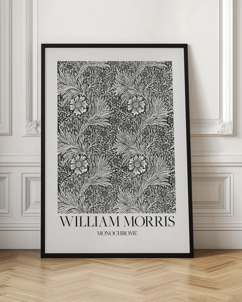 A framed art print featuring a classic William Morris pattern in monochrome. The intricate black and white design is filled with dense, swirling foliage and stylized flowers. The artwork has a white border, and at the bottom, the text 'WILLIAM MORRIS' is displayed prominently, with 'MONOCHROME' written underneath in a smaller font. Artwork
