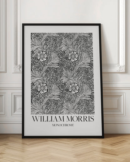A framed art print featuring a classic William Morris pattern in monochrome. The intricate black and white design is filled with dense, swirling foliage and stylized flowers. The artwork has a white border, and at the bottom, the text 'WILLIAM MORRIS' is displayed prominently, with 'MONOCHROME' written underneath in a smaller font. Artwork