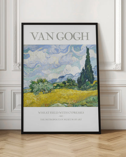 A framed museum poster of Vincent van Gogh's 'Wheat Field with Cypresses.' The impressionist painting depicts a golden wheat field under a swirling blue sky, with dark green cypress trees to the right and distant blue mountains. Decor